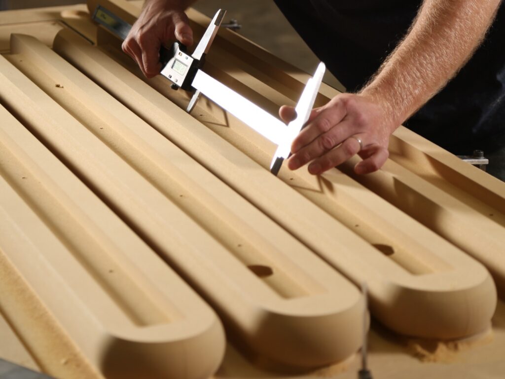 Measuring for custom shapes on the CNC machine.
