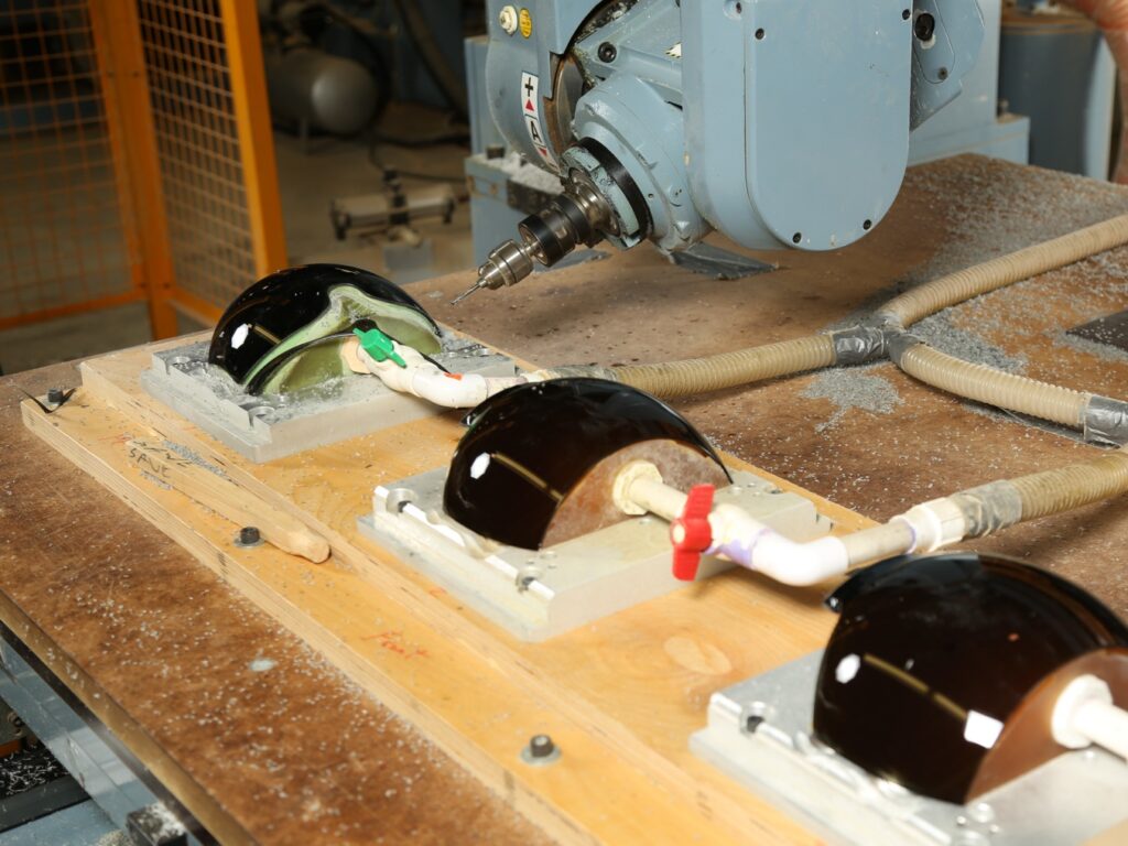 CNC machining of diverse materials including wood, plastics, metals, and composites by Paladin Industries.