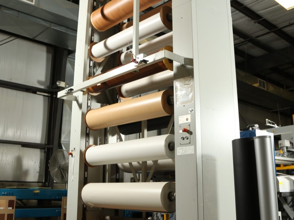 Stack of laminate rolls showing the variety of colors and materials.